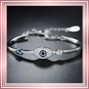 Crystal & Silvertone Evil Eye Symbolic Bangle